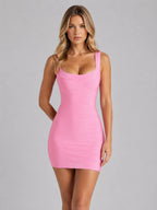 Front view of model wearing pink bandage mini dress with square scoop neckline