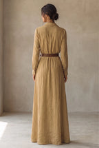 Back view of the khaki maxi dress showing the collared yoke, long sleeves and thin brown belt at the waist