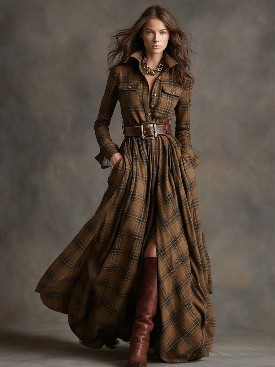 Full-body studio shot of the belted tartan maxi shirt dress styled with a gold chain necklace and boots