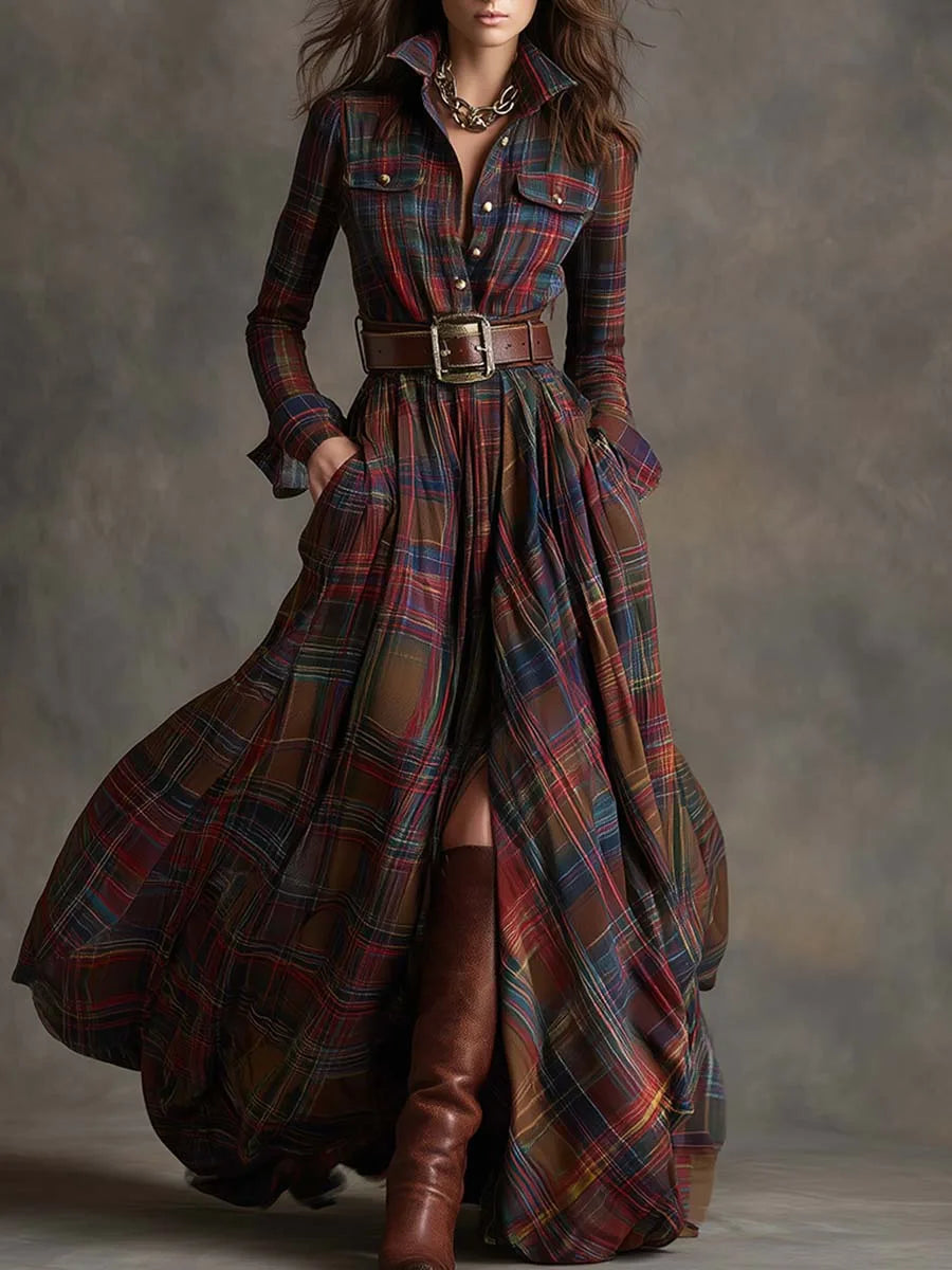 Front view of a red and navy plaid maxi shirt dress cinched with a wide brown belt, worn with boots
