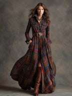 Full-length shot of a model in a red and navy plaid belted maxi shirt dress with flared hemline