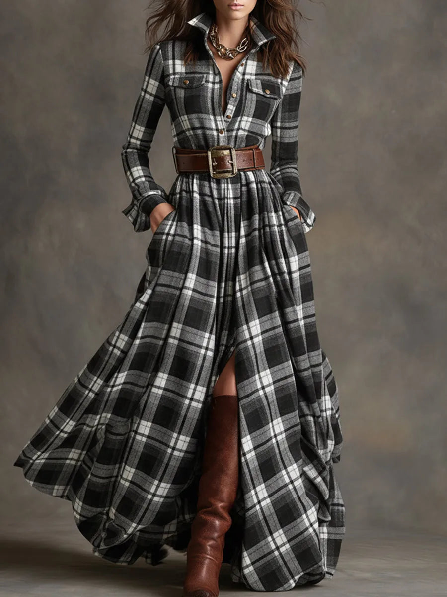 Front view of a black and white check belted shirt dress with pleated maxi skirt and brown boots