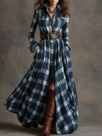 Front view of a navy and cream plaid belted shirt dress with button-down bodice and flared skirt