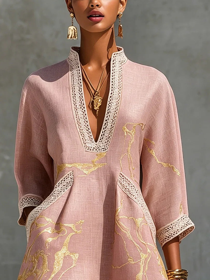 Close-up of crochet lace V-neckline and lace-trimmed pocket on pink mini dress, showing gold marble pattern and fabric texture