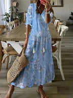 Light blue floral print maxi dress with soft V-neck, tasselled tie and relaxed A-line silhouette