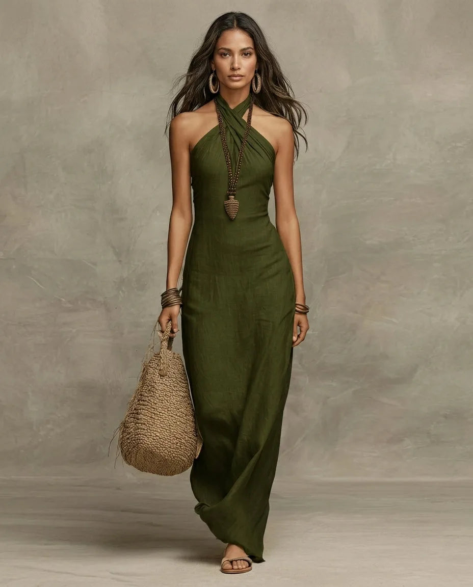 Olive green linen halter maxi dress with open-shoulder cut, worn with hoop earrings and a knotted bag