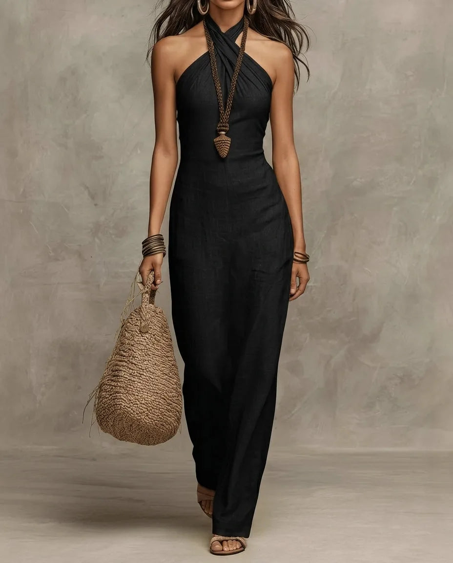 Black linen halter maxi dress, front view showing the slim silhouette and ankle-grazing hemline
