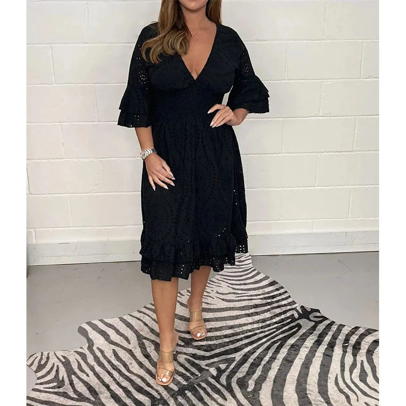 Black eyelet lace midi dress with plunging V-neck and double-layer ruffle sleeves, styled with clear strap heels
