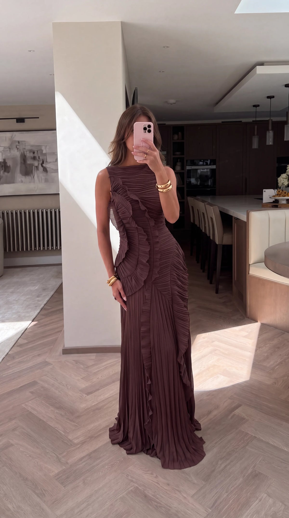 Full length mirror selfie showing the fitted waist, ruffle trim and floor-length pleated skirt silhouette