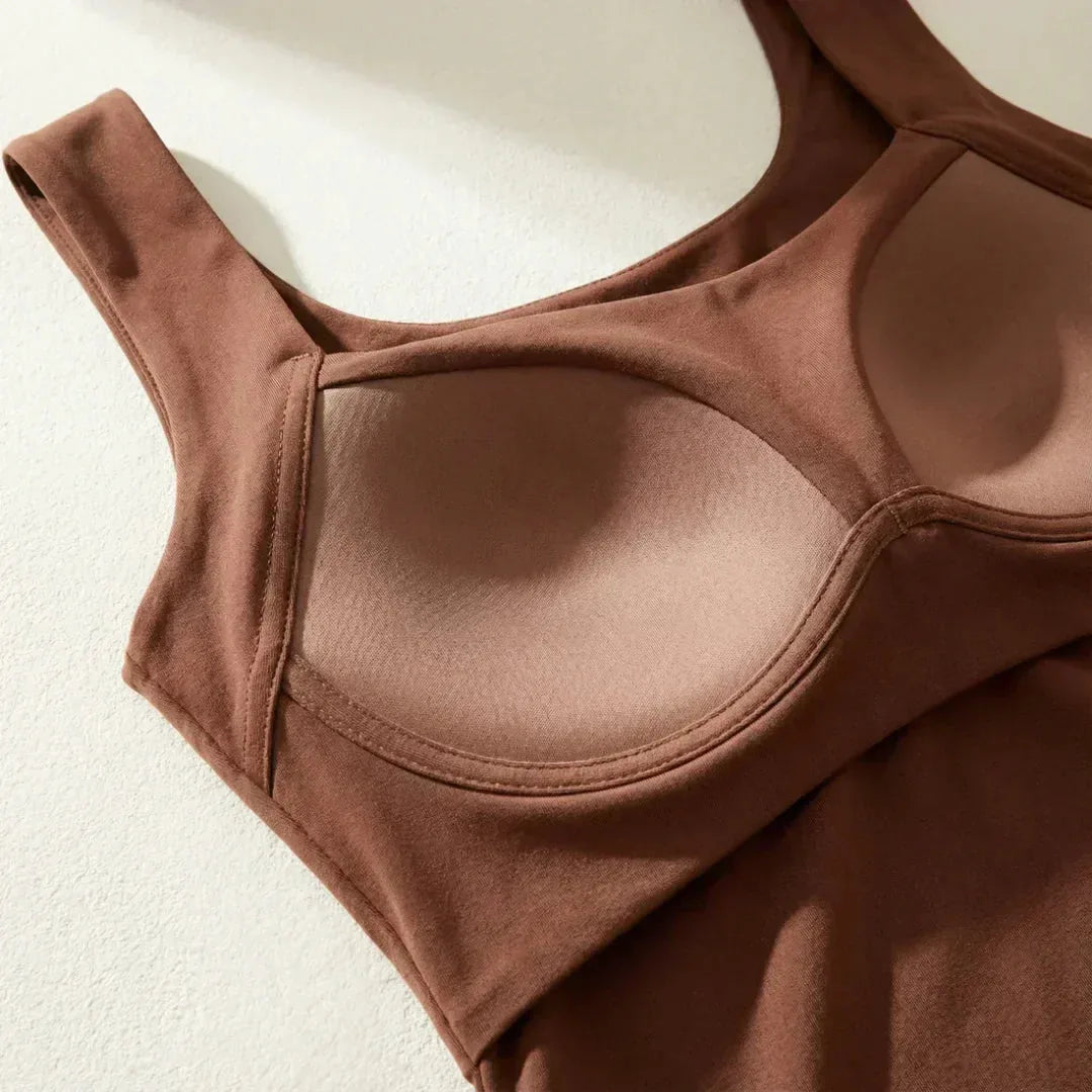 Flat lay close-up of the built-in shelf bra with underwire-style support cups in brown