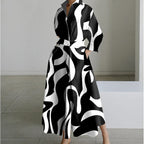 Three quarter view showing the balloon sleeve and collared neckline of the maxi shirt dress
