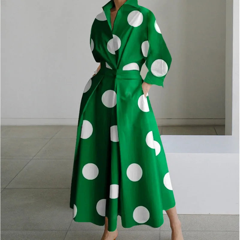 Back view of the maxi shirt dress showing the flowing pleated skirt and relaxed drape