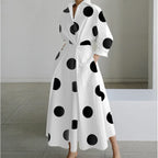 Close-up of the collared V-neckline and button placket on the maxi shirt dress