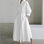 Full length view of the maxi shirt dress highlighting the long hemline and wide skirt silhouette