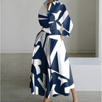 Navy and white geometric print maxi shirt dress with collared neckline and twisted waist tie
