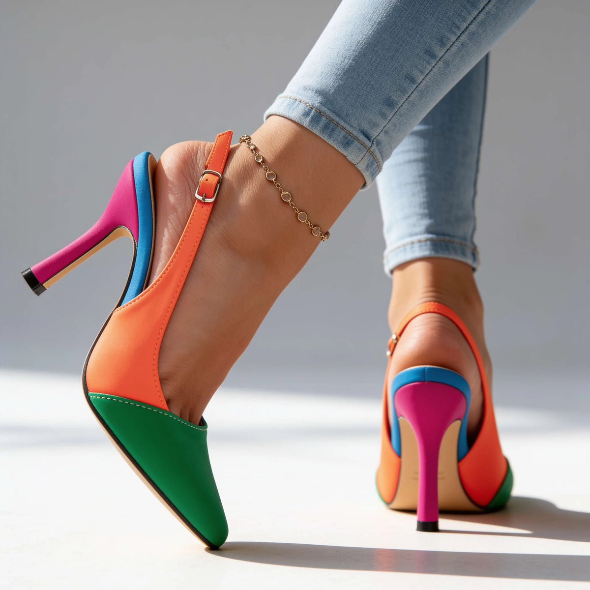 Back and side view of green and orange slingback heels highlighting the multicolour stiletto and ankle strap buckle