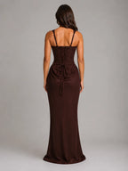 Back view of the brown maxi dress showing lace-up corset detailing and gathered skirt drape