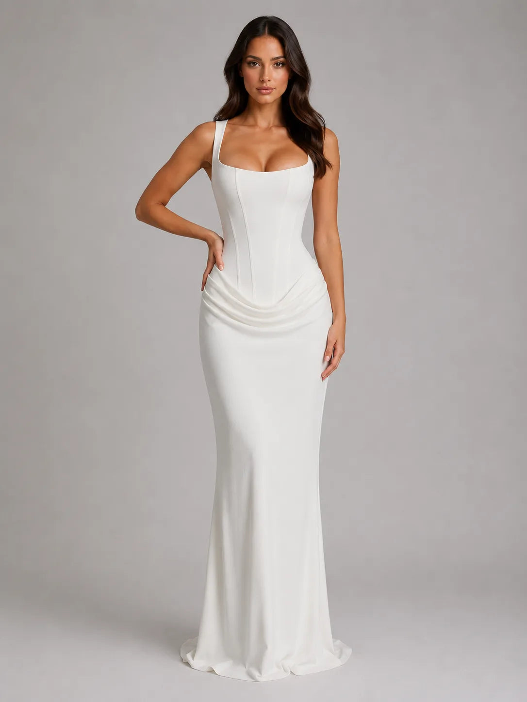 Front view of an ivory white corset maxi dress with square neckline, fitted bodice and flowing skirt