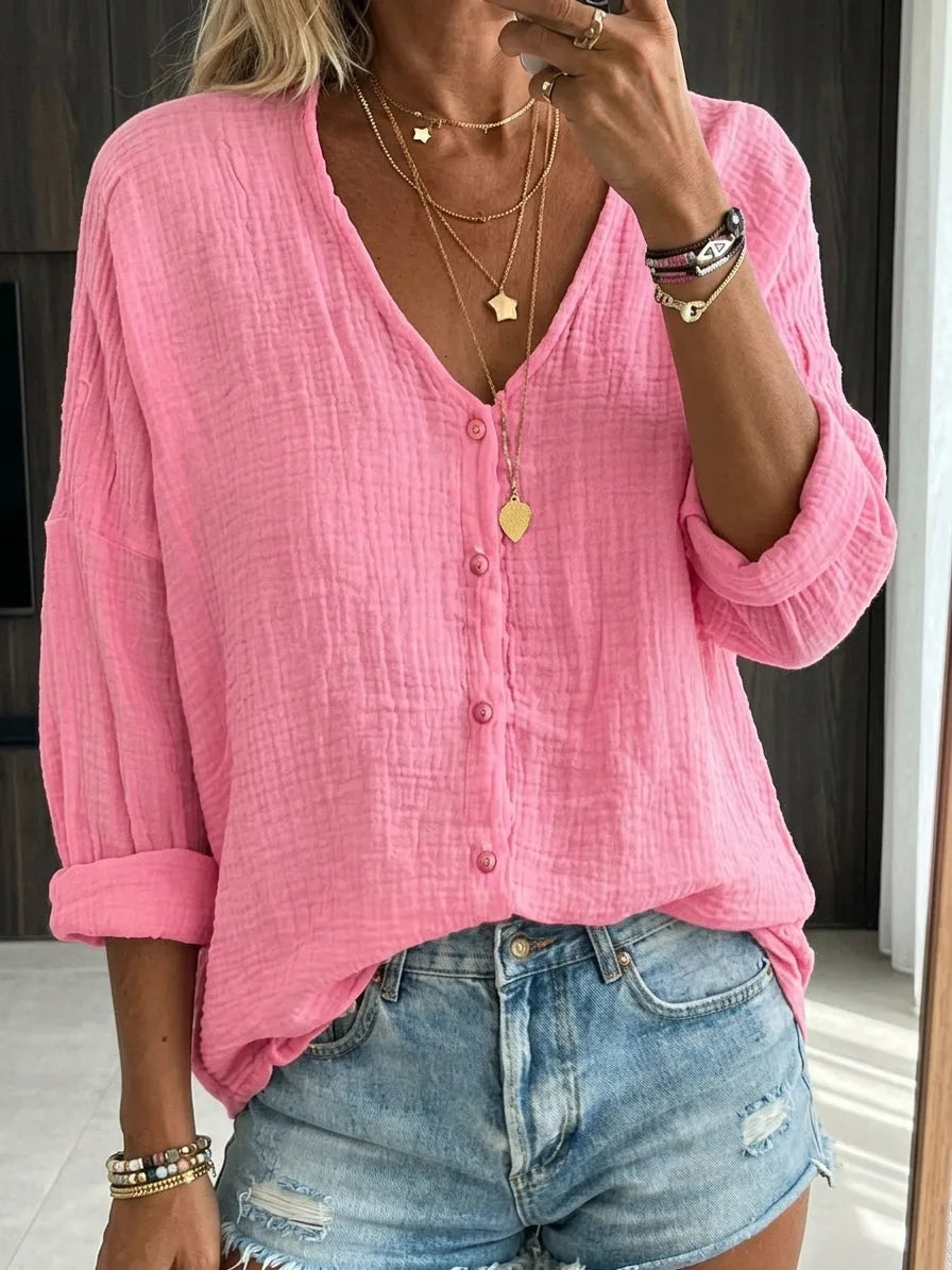 Bright pink crinkled cotton linen blouse with button front detail and oversized relaxed fit.
