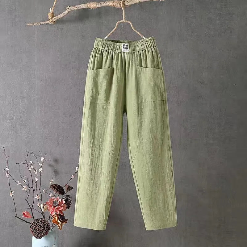 Detail shot of the elastic drawstring waistband and fabric texture on a pair of cotton linen pants