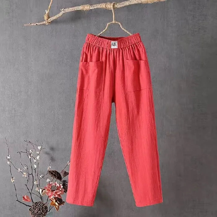Red cotton linen pants hanging straight, highlighting the ankle-length straight leg and side pockets