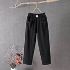 Side-by-side thumbnail grid of the pants in green, black, white, red and grey colourways