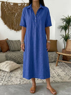 Cobalt blue oversized polo dress with short sleeves and relaxed silhouette shown from the front