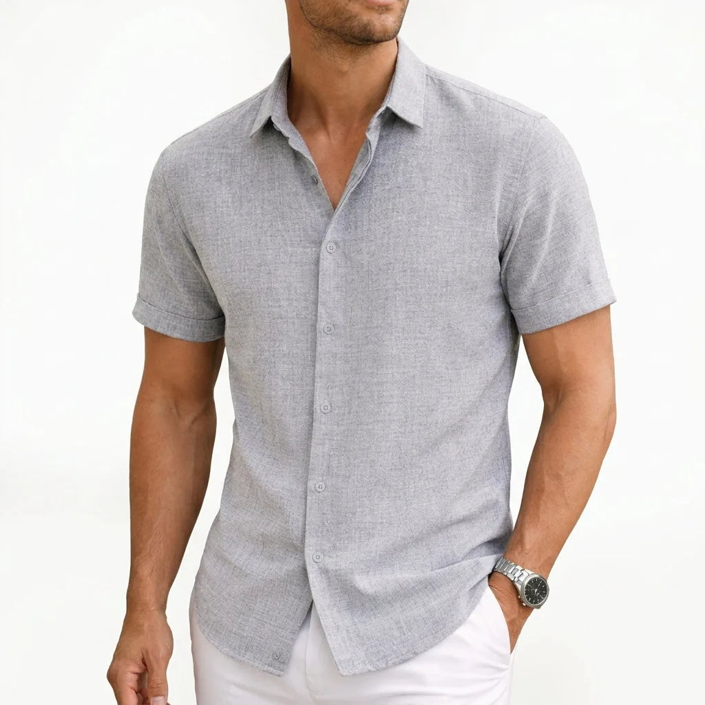 Light grey button-up shirt in a fine woven texture, shown with sleeve cuffs turned up