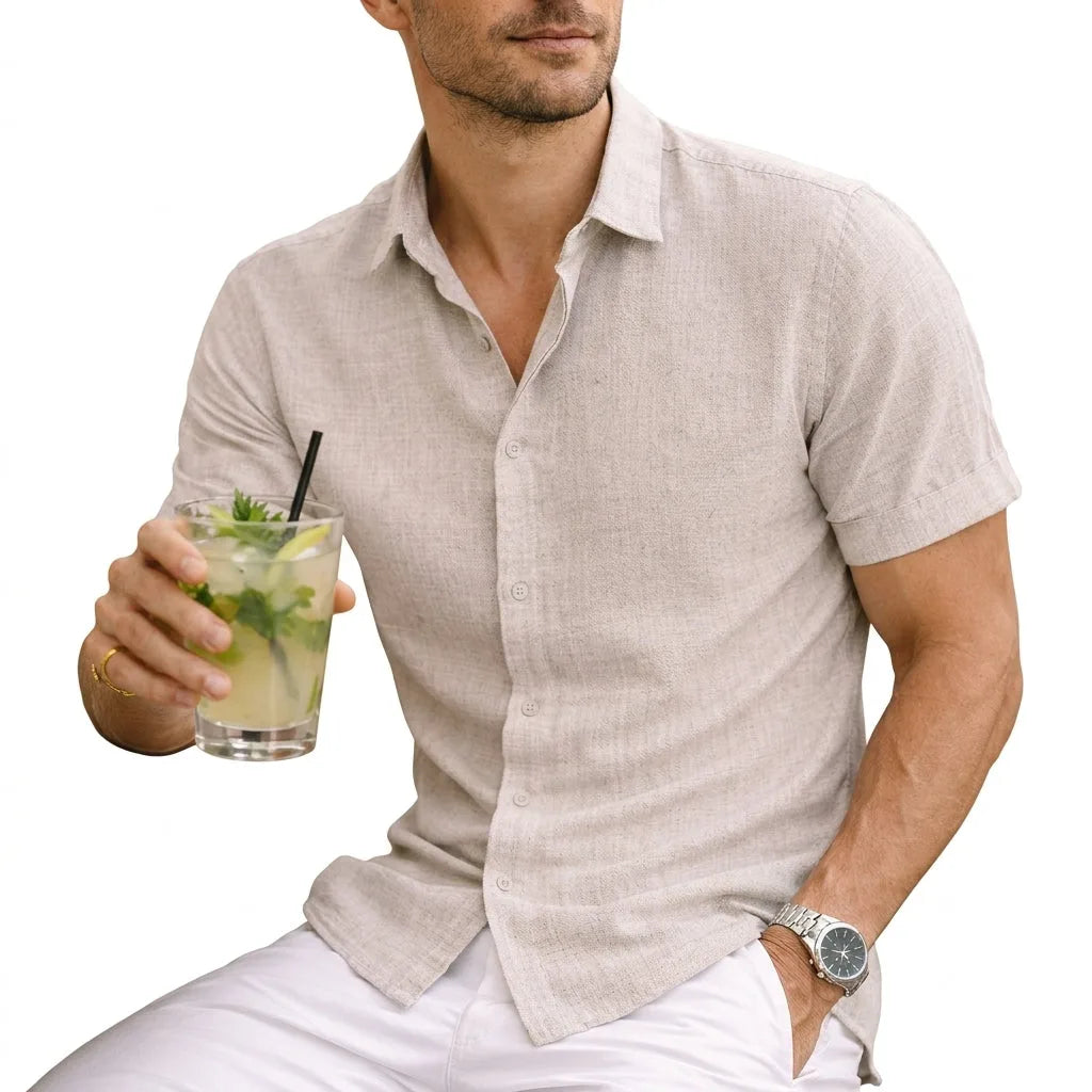 Beige textured cotton shirt with short sleeves, worn casually while holding a drink