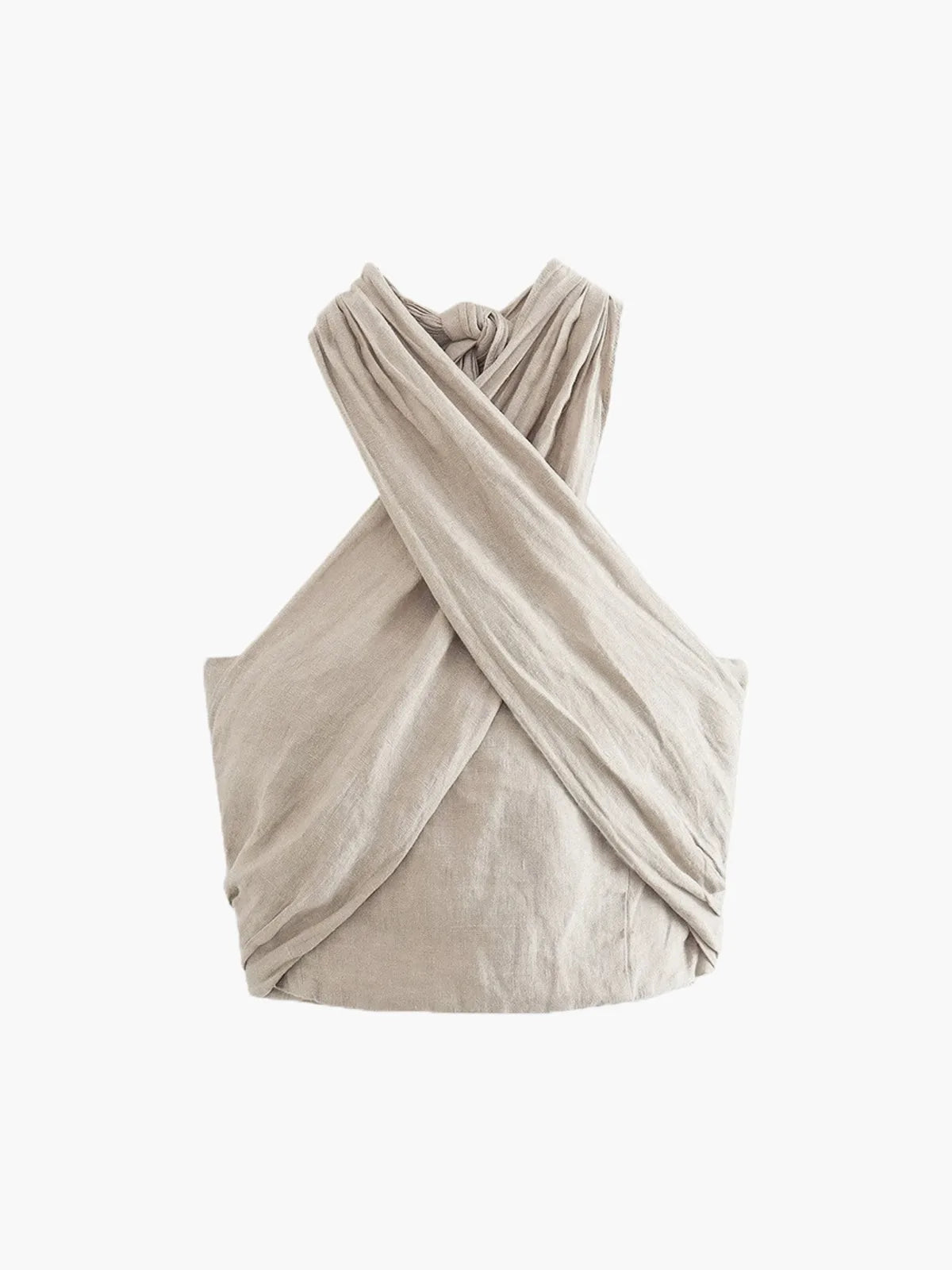 Flat lay of the beige crisscross halter top on a plain background, showing the full wrap silhouette