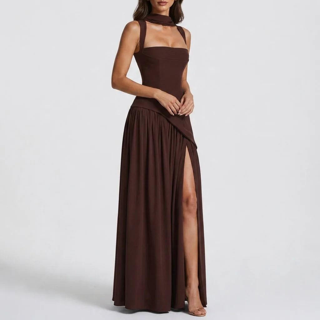 Side view of a deep brown satin maxi dress with square neckline, fitted corset bodice and asymmetric draped skirt with high slit