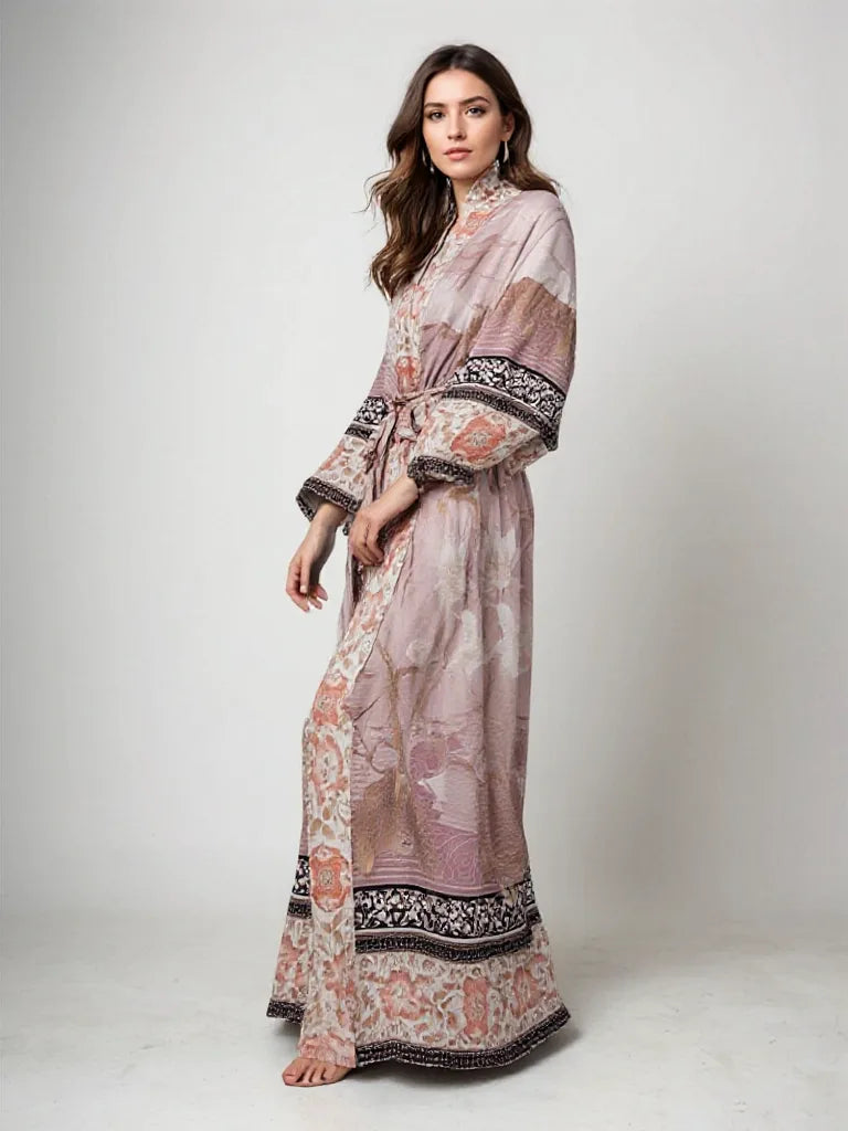 Woman in dusty rose floral kimono with mandarin collar and sash belt, shown in a side profile studio shot