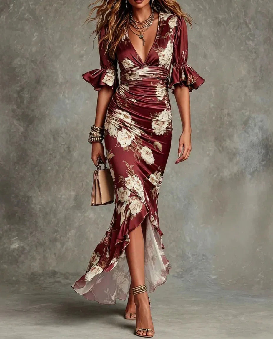 Front view of the dress in deep red floral satin showing the sheer ruffle trim along the hem