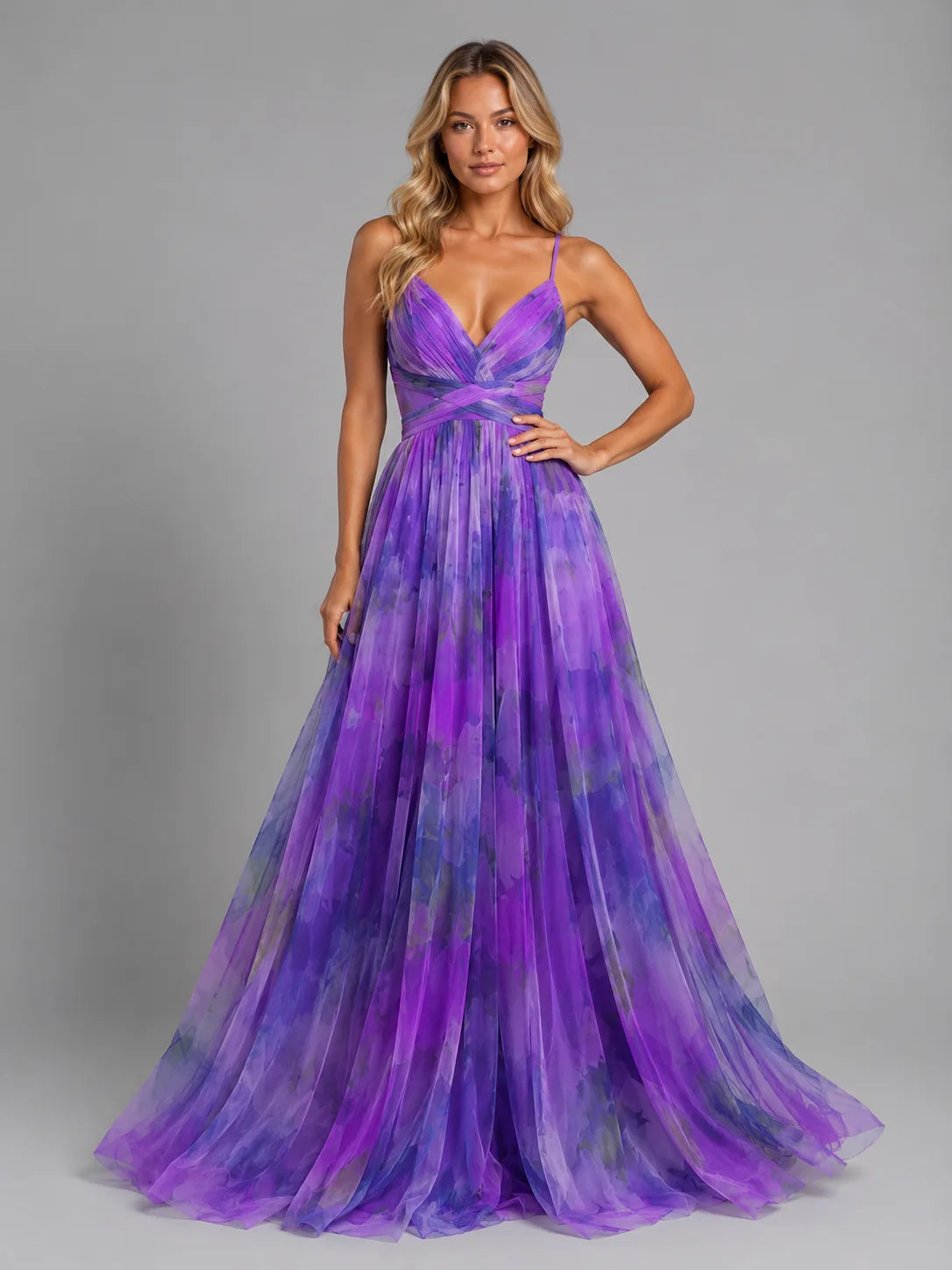Model in a purple watercolour floral version of the maxi dress with adjustable spaghetti straps