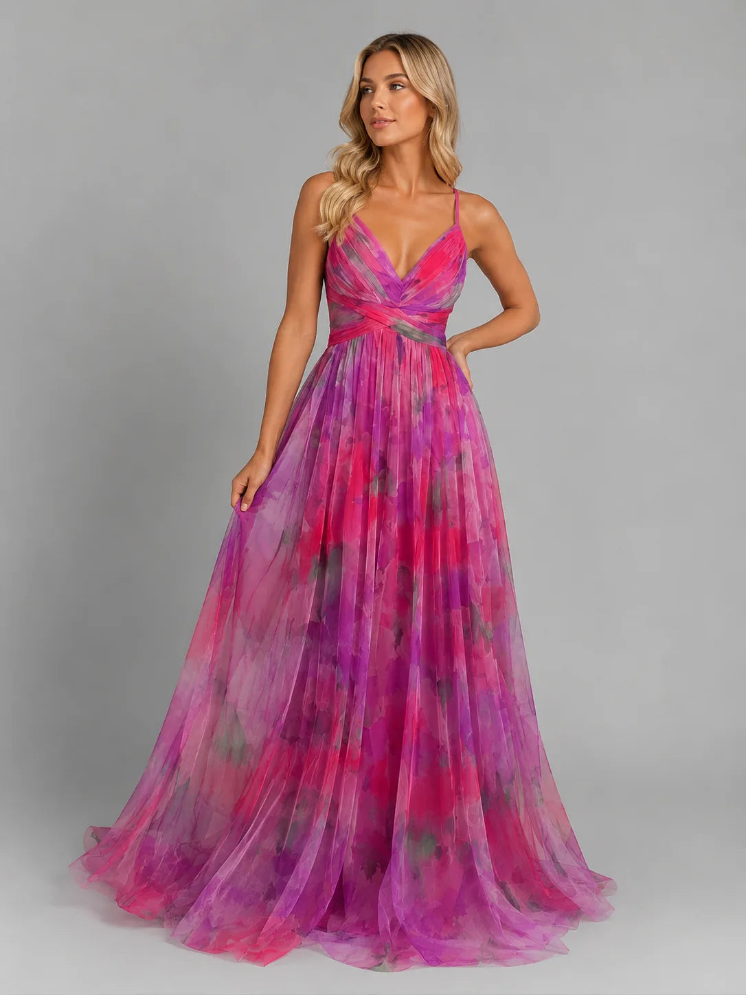 Model wearing the pink and magenta watercolour floral gown with fitted waist and flowing A-line skirt