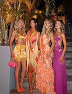 Alternate angle of the group shot highlighting the open-back strappy design of the pink shimmer maxi dress