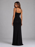 Back view showing adjustable spaghetti straps, boned corset bodice and gathered ruching along the fitted black glitter maxi skirt
