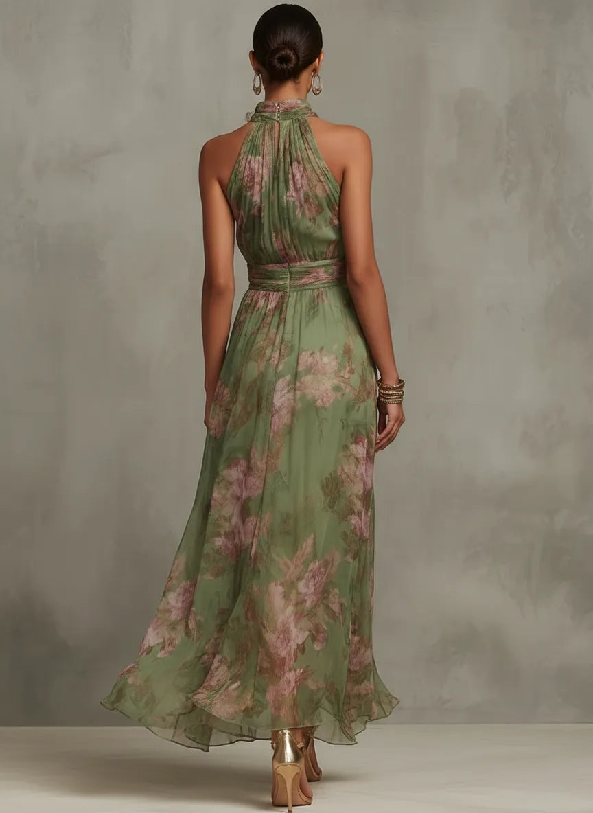 Back view of the green floral maxi dress showing the halter tie closure and gathered waistband detail