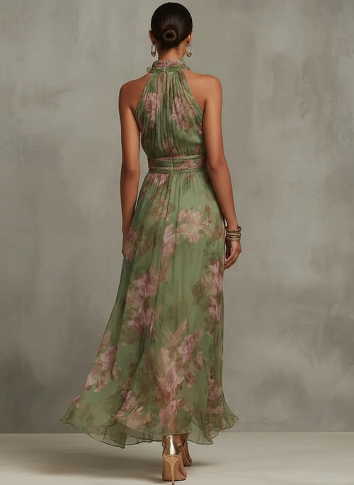 Back view of the green floral maxi dress showing the halter tie closure and gathered waistband detail