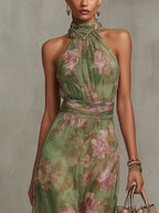 Close-up of the halter neckline with metallic trim detail and soft draping across the floral chiffon bodice