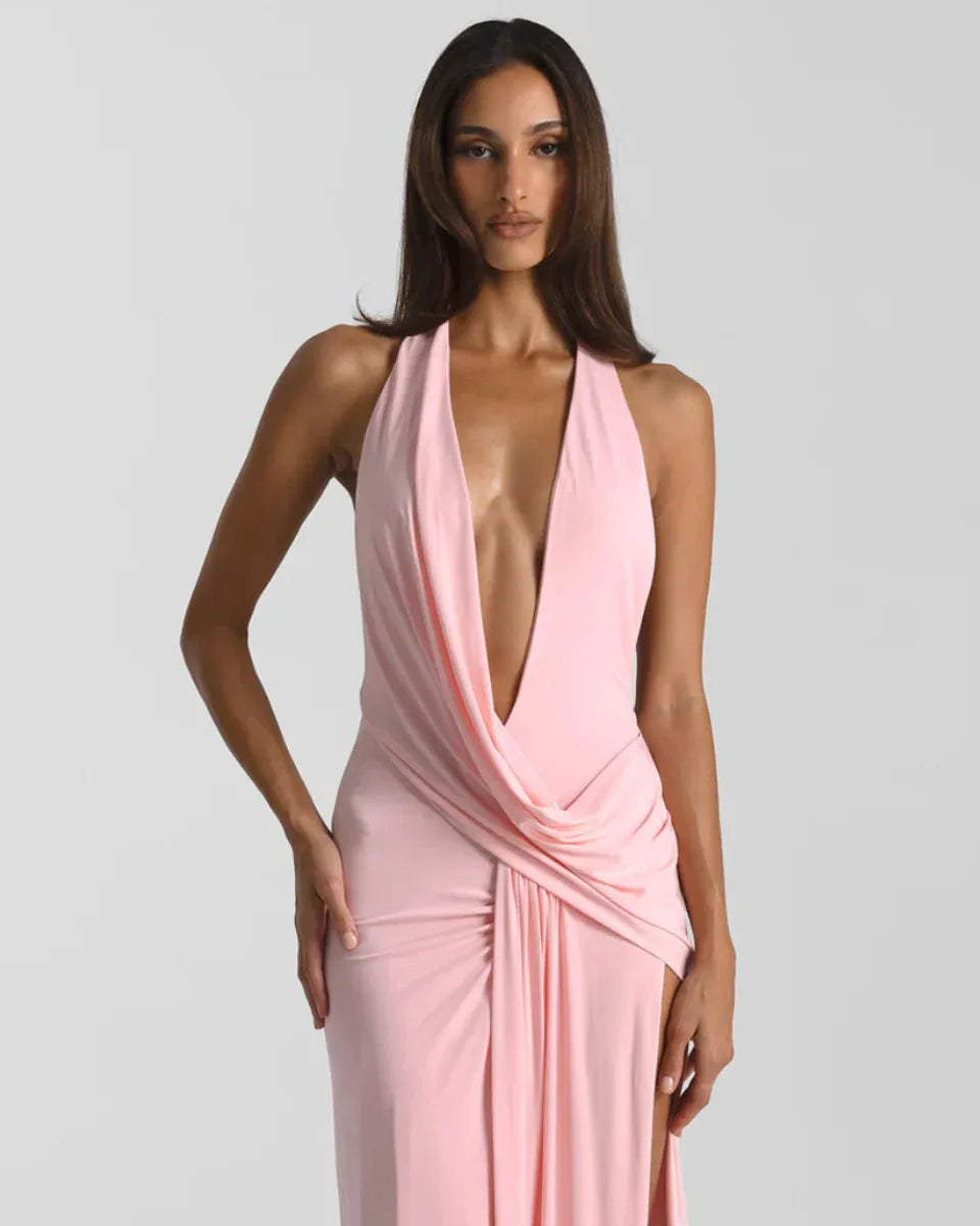Three-quarter view showing the flowing train and soft jersey drape of the maxi dress skirt