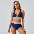 Dark blue halter neck bikini set with striped contrast waistband and adjustable side-tie bottoms