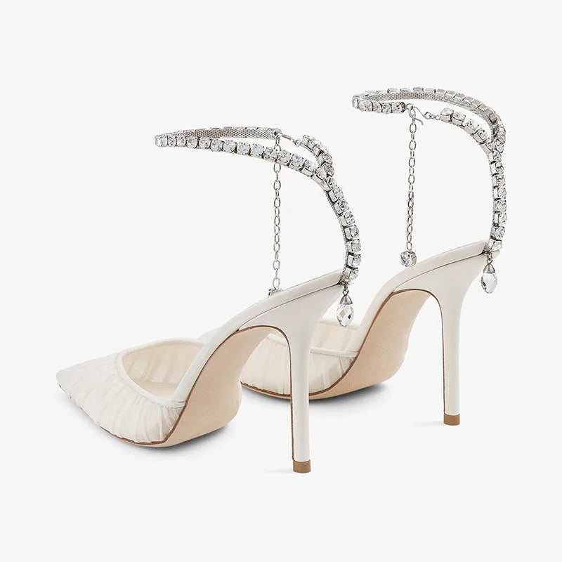 Back three-quarter view highlighting the stiletto heel height and the crystal chain drop at the ankle