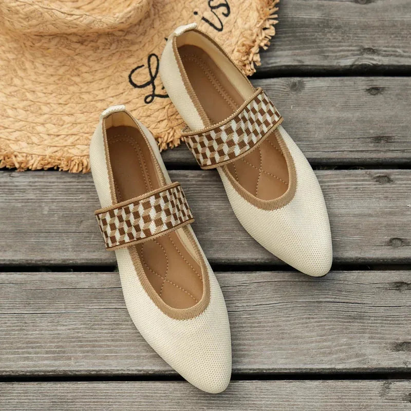Top-down view of beige knit pointed-toe flats with a brown and cream checkerboard woven strap