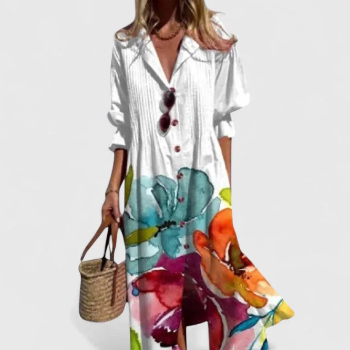 White collared maxi shirt dress with a watercolour floral border in teal, orange and pink across the lower skirt