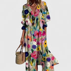 Long sleeve maxi shirt dress in a colourful painterly floral print with a pleated bodice and button-up front