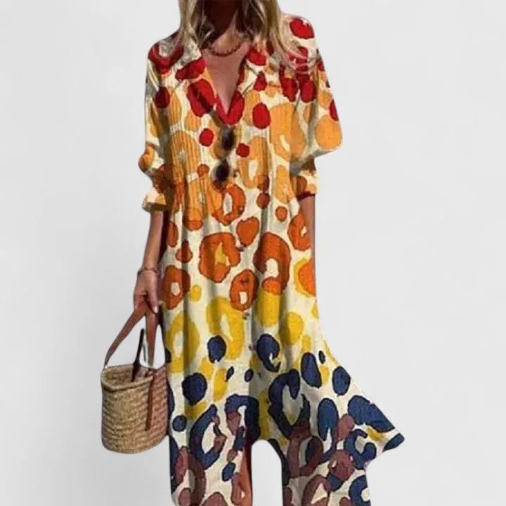 Maxi shirt dress in a warm leopard-style print of orange, yellow and navy with a collared neckline and long sleeves