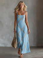 Light blue maxi dress with crisscross woven-look trim, full front view with model walking forward