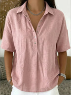 Dusty pink collared blouse with button front detail, paired with silver chain jewellery
