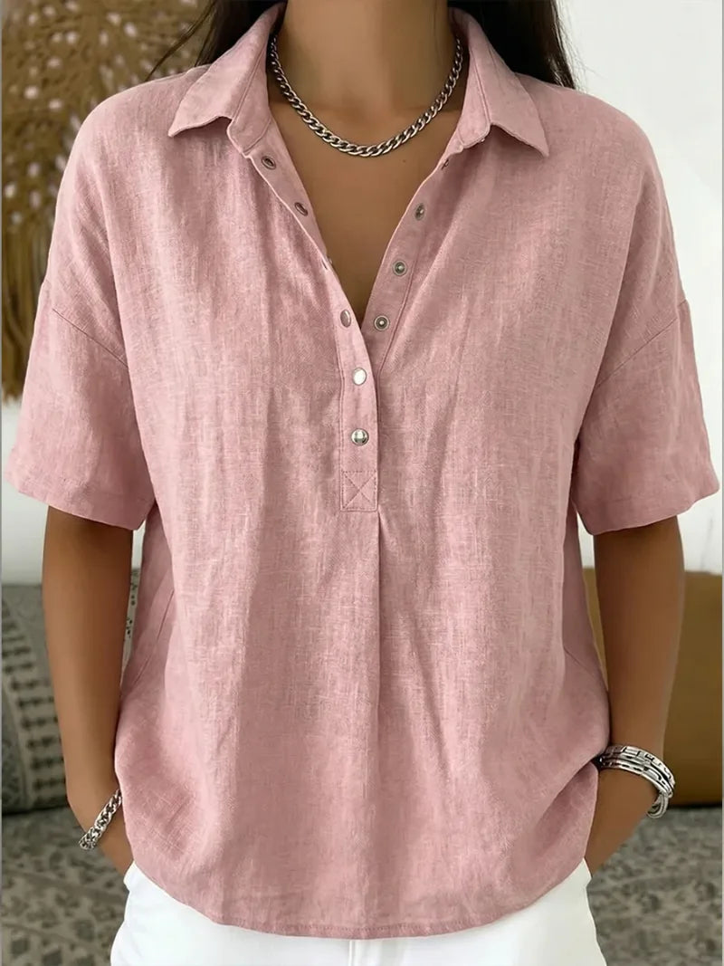 Dusty pink collared blouse with button front detail, paired with silver chain jewellery